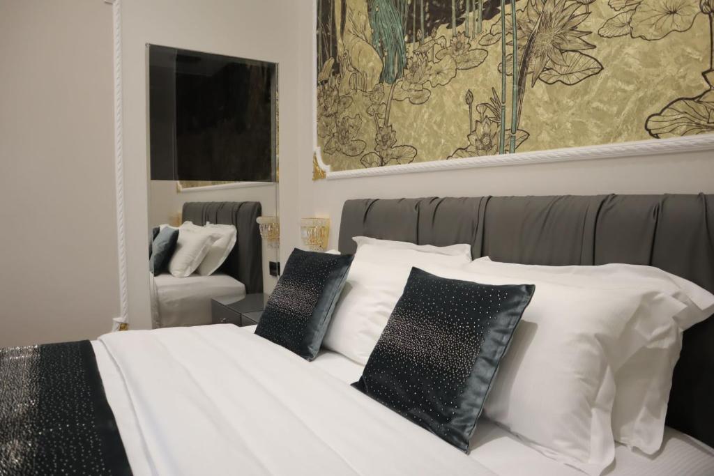 Postel nebo postele na pokoji v ubytování Queen Cattleya Suite