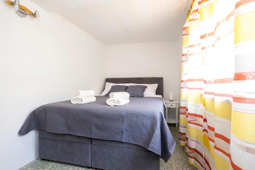 Postel nebo postele na pokoji v ubytování Apartment Martina by El-Pi Tours