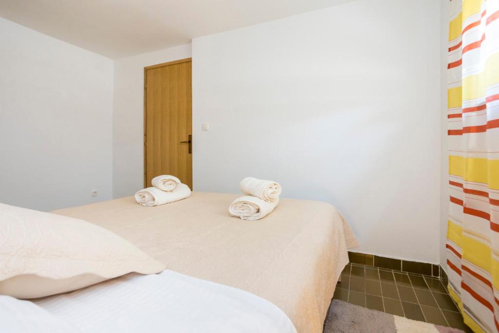 Postel nebo postele na pokoji v ubytování Apartment Martina by El-Pi Tours