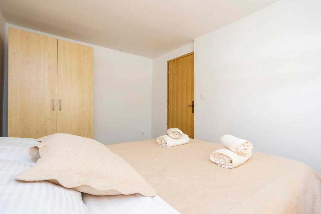 Postel nebo postele na pokoji v ubytování Apartment Martina by El-Pi Tours