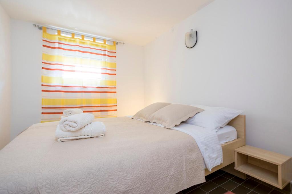 Postel nebo postele na pokoji v ubytování Apartment Martina by El-Pi Tours