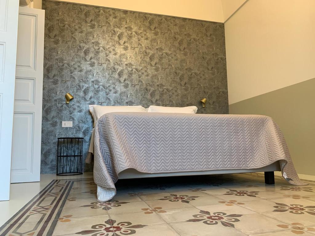 Postel nebo postele na pokoji v ubytování Il Sogno di Mimì