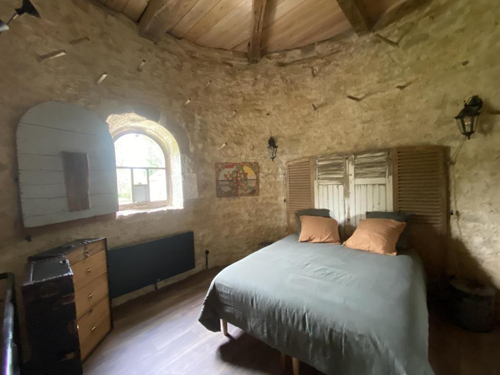 Postel nebo postele na pokoji v ubytování Le Colombier de Malpas