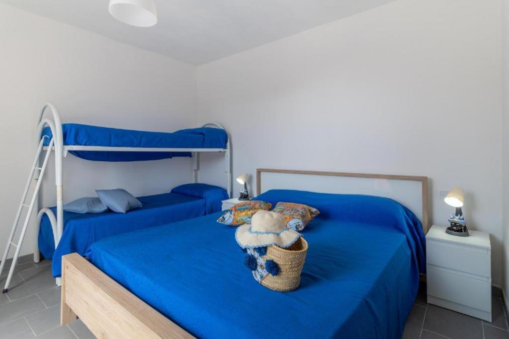 Postel nebo postele na pokoji v ubytování Oasi del mare