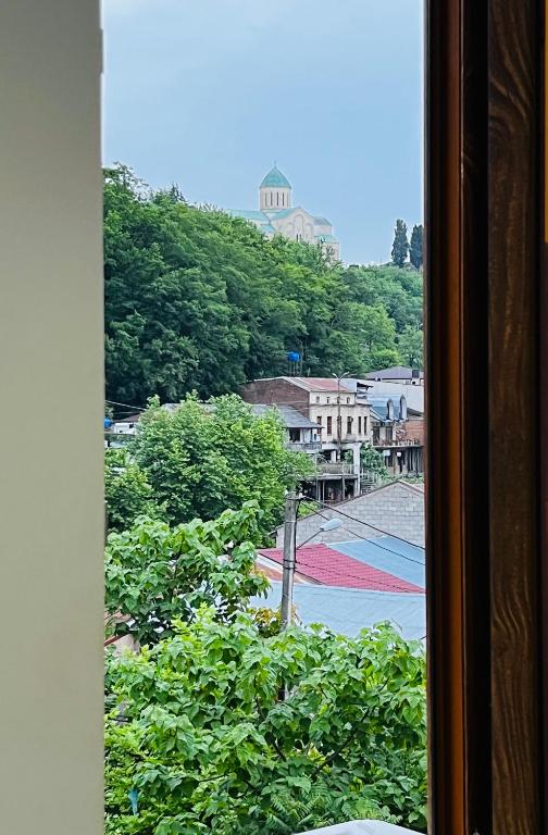 a view of a city from a window at Georgian Palace Hotel in Kutaisi
