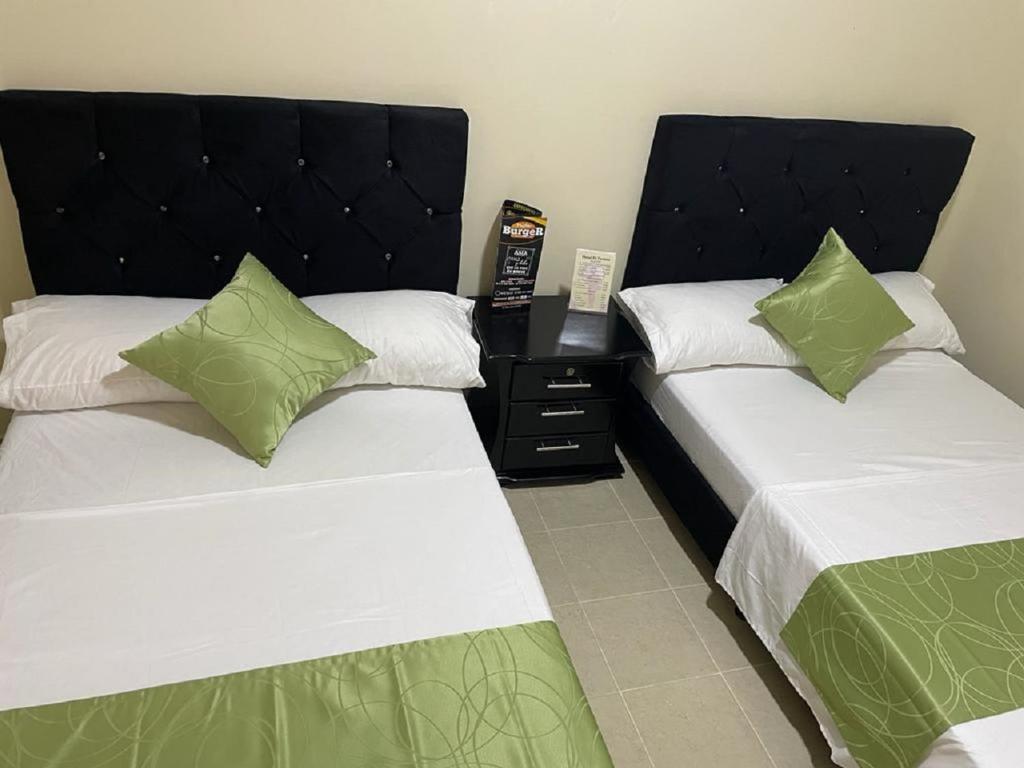 Postel nebo postele na pokoji v ubytování Hotel el Turista