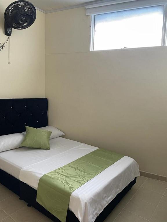 Postel nebo postele na pokoji v ubytování Hotel el Turista
