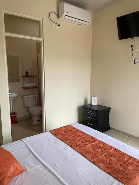 Postel nebo postele na pokoji v ubytování Hotel el Turista
