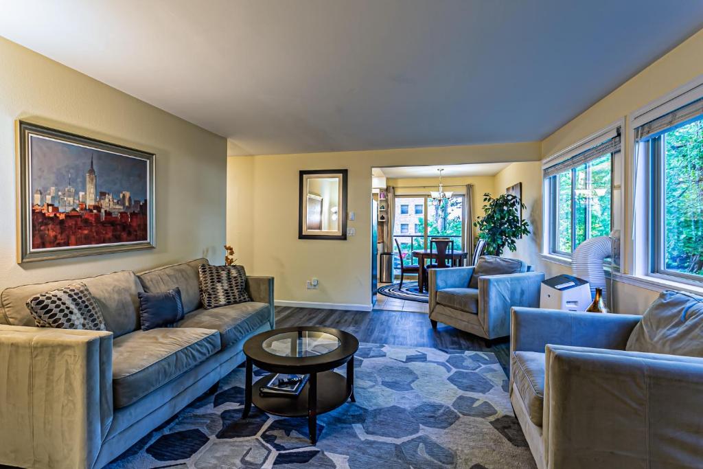 a living room with couches and a table at the Lanai, Best Area, 2 Bedrooms, WD, Large Balcony, Condo, 825sf in Tacoma