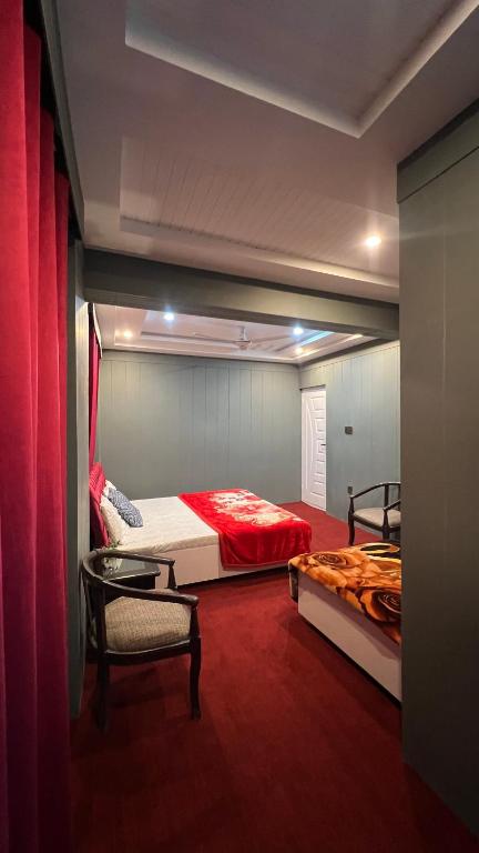 Postel nebo postele na pokoji v ubytování Skardu Lodge