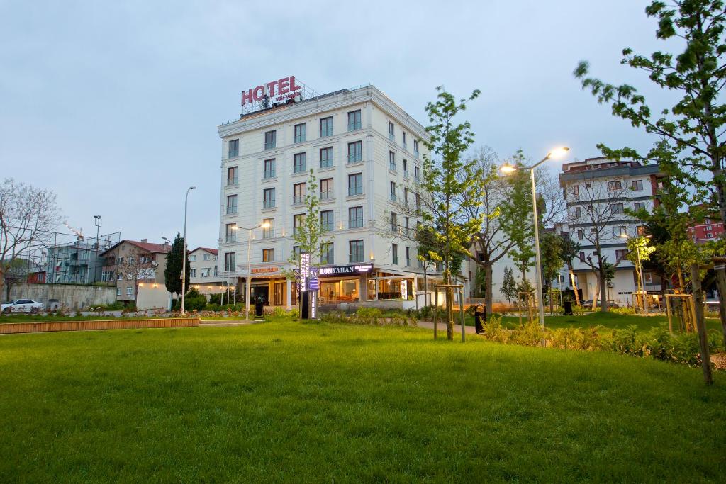 a large white building with a park in front of it at Villa Vanilla Hotel in Istanbul