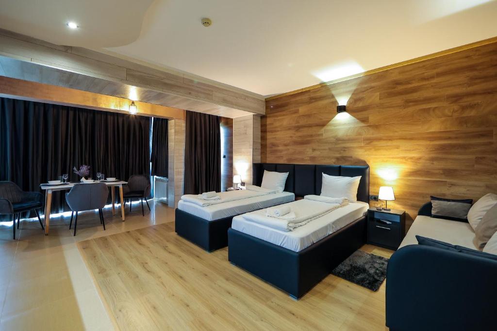 Postel nebo postele na pokoji v ubytování Family Hotel Gotse Delchev