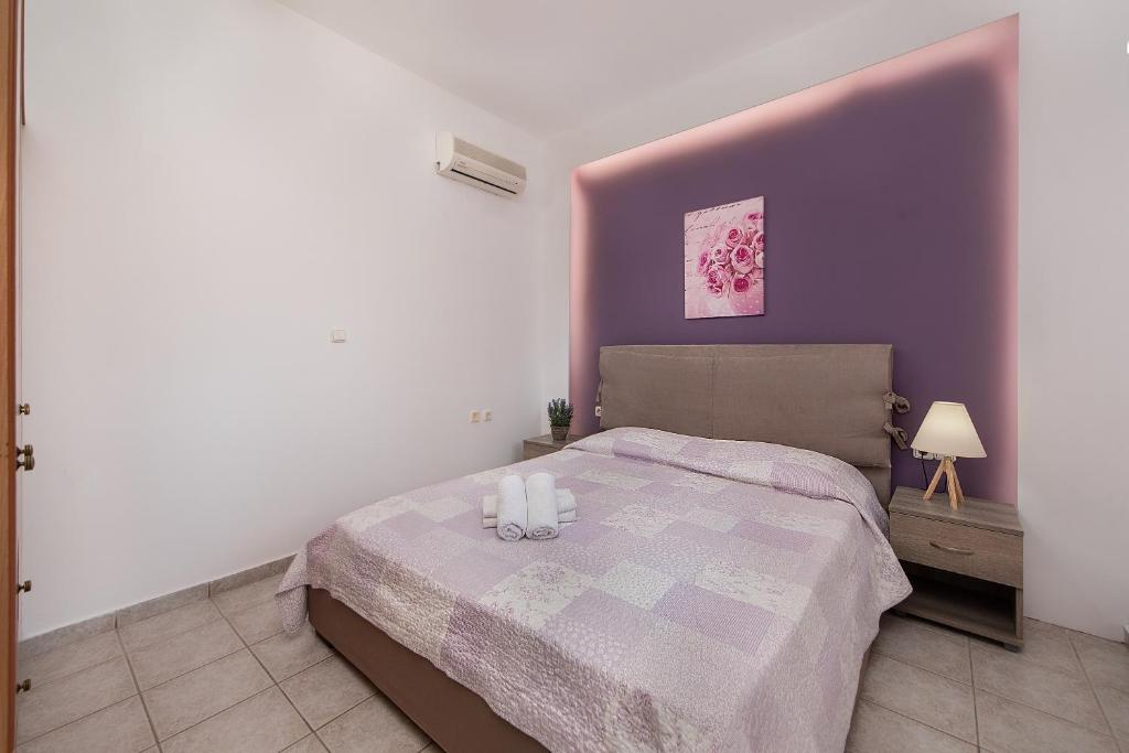 Postel nebo postele na pokoji v ubytování Iliana Apartment