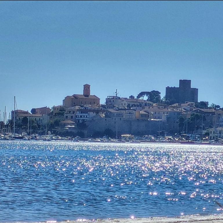 a view of a city from a body of water at La mia Casa a Talamone in Talamone