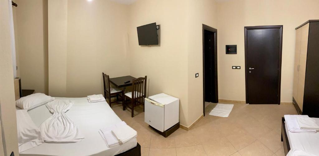 Postel nebo postele na pokoji v ubytování AL Hotel