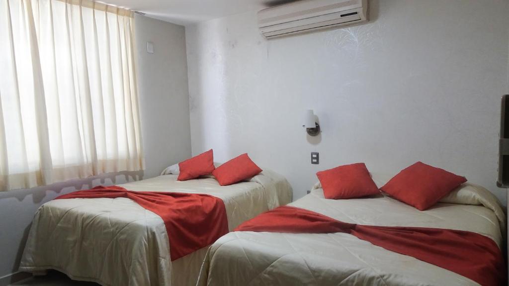Postel nebo postele na pokoji v ubytování Suites San Luis