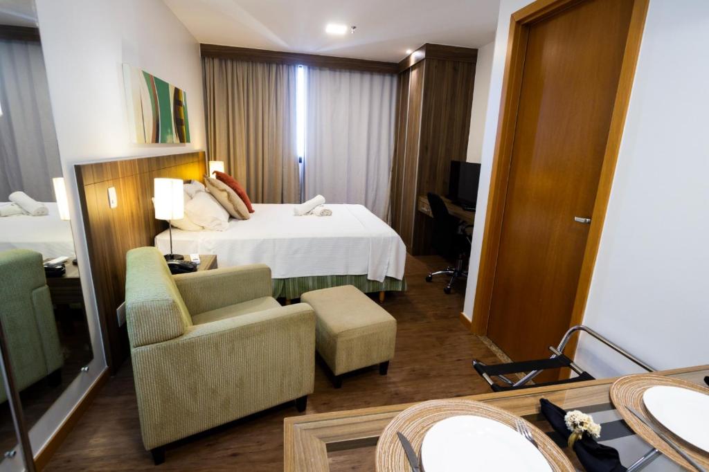 En eller flere senge i et værelse på Apartamento, Nobile Suítes Monumental , localização e conforto