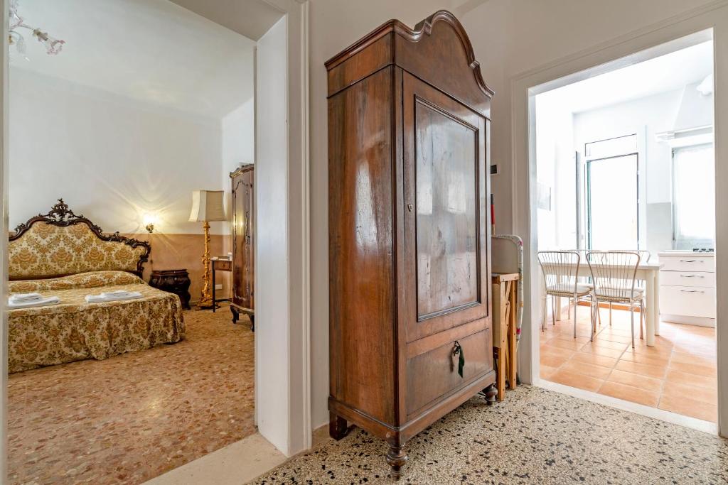 Posteľ alebo postele v izbe v ubytovaní Queen House Venezia