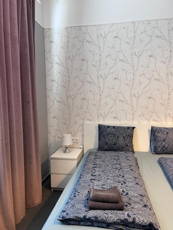 Postel nebo postele na pokoji v ubytování Downtown Apartments