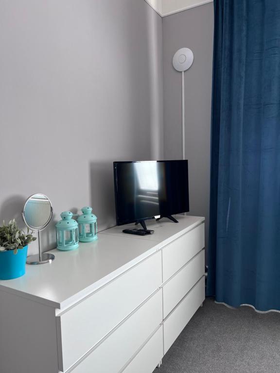 TV a/nebo společenská místnost v ubytování Downtown Apartments