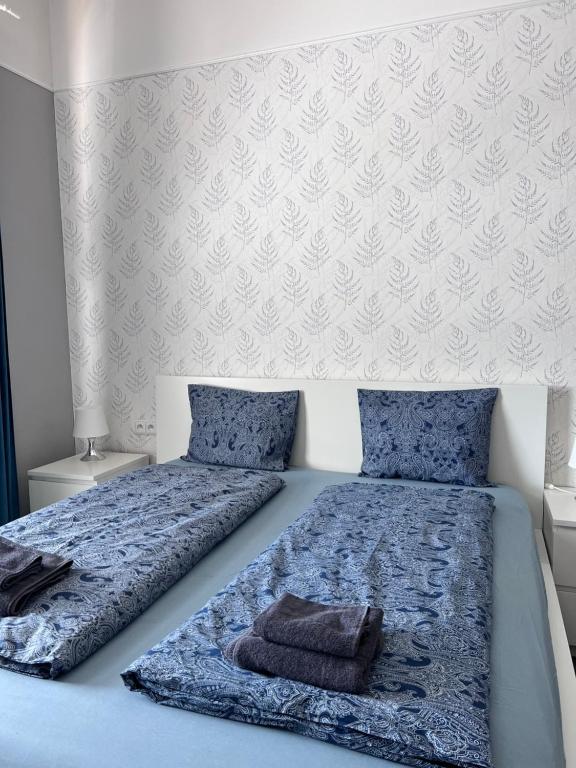 Postel nebo postele na pokoji v ubytování Downtown Apartments