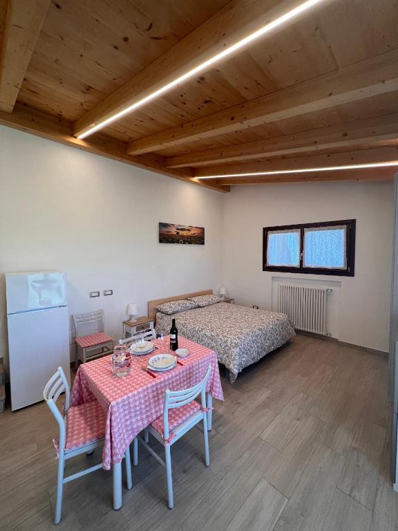Postel nebo postele na pokoji v ubytování Antico Stemma Corte Meneghella