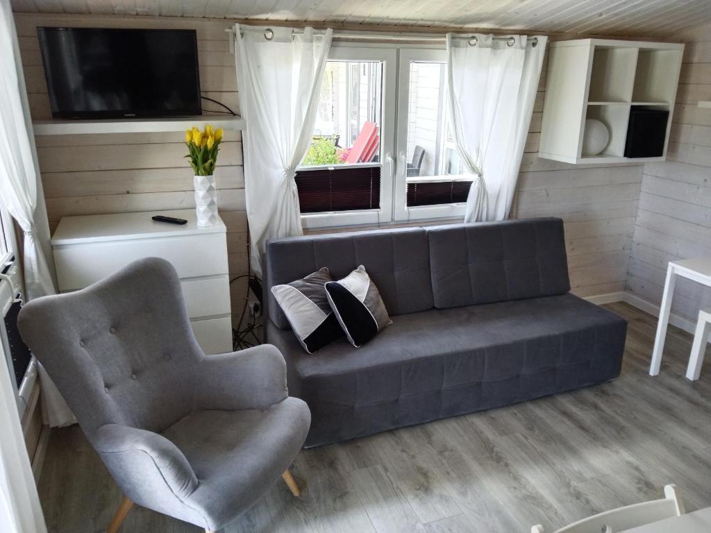 Posezení v ubytování Domki LA MER z własnymi ogródkami- Balia z jacuzzi ,sauna ,rowery, klimatyzacja