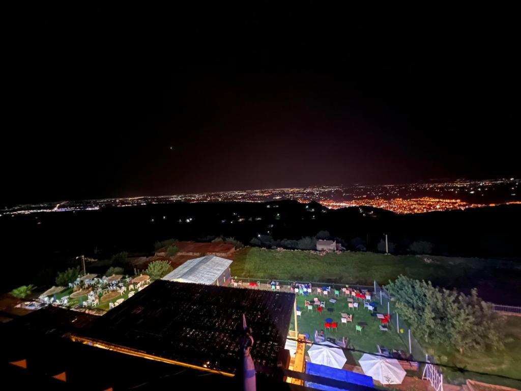 an aerial view of a field at night at maison d'hôtes yamine in Beni Mellal