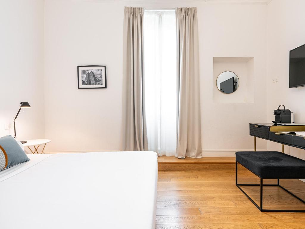 Televízia a/alebo spoločenská miestnosť v ubytovaní PLEY Boutique Del Centro