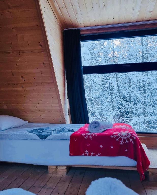 Postel nebo postele na pokoji v ubytování Wooden Huts In Mestia