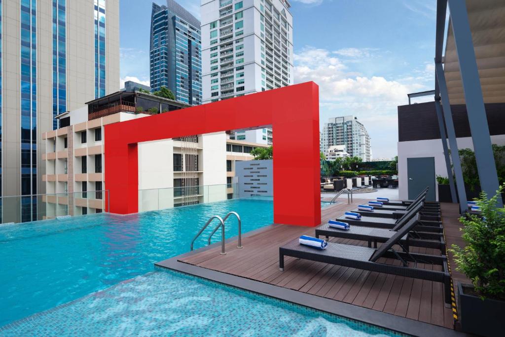 a pool on the roof of a building at Four Points by Sheraton Bangkok, Sukhumvit 15 in Bangkok