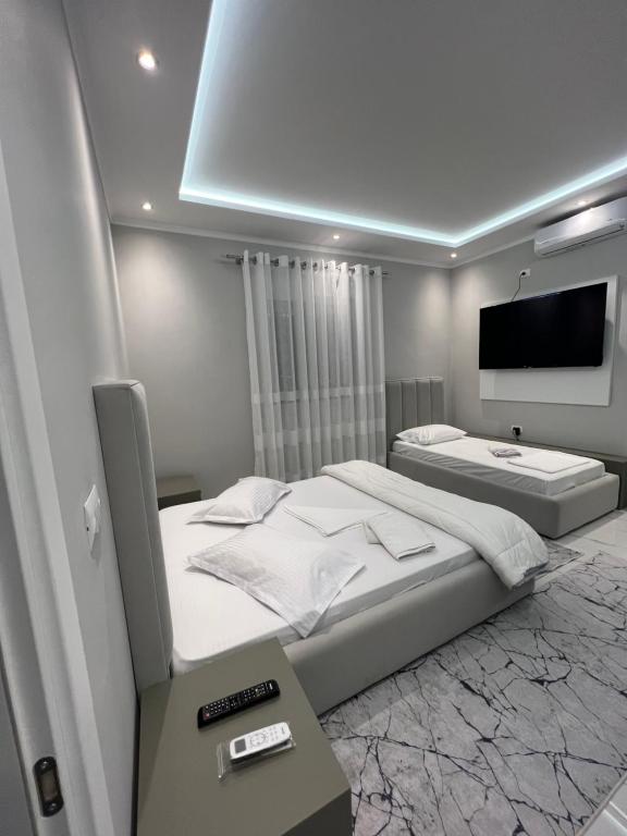 Rúm í herbergi á Guesthouse BellaVista