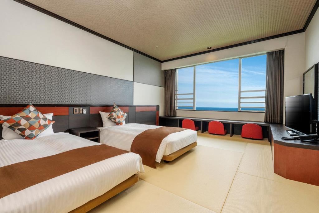 TV a/nebo společenská místnost v ubytování Hotel New Akao