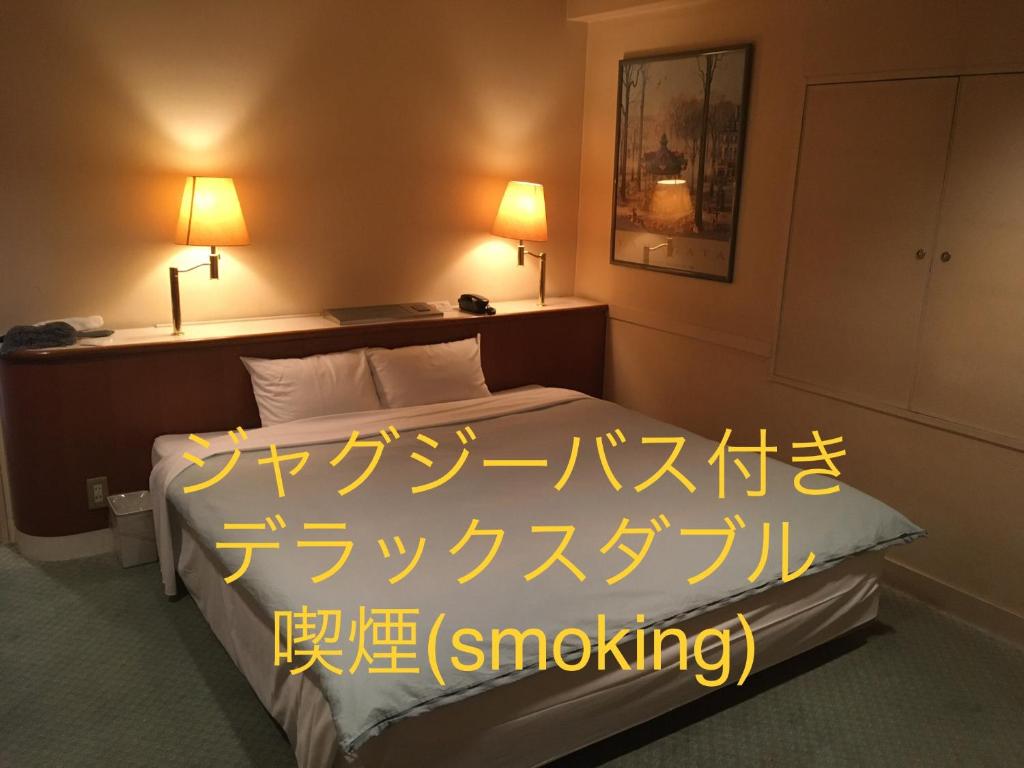 Postel nebo postele na pokoji v ubytování Hotel Noel