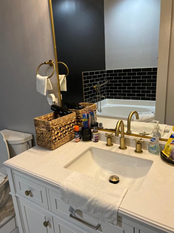 a bathroom with a sink and a bath tub at Welcome to the AUC Modern Unit in Atlanta
