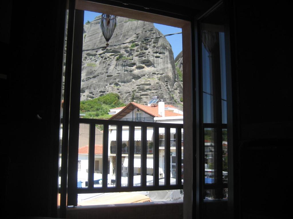 a view of a mountain from a window at Mythos Guesthouse in Kalabaka