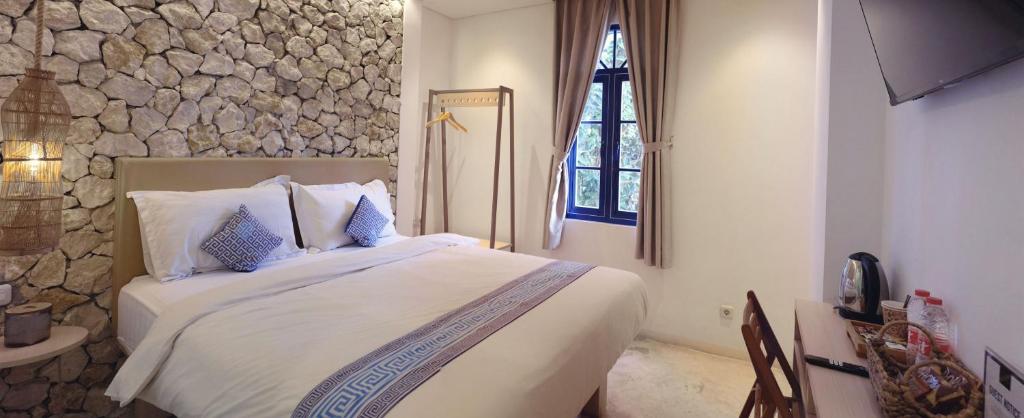 Postel nebo postele na pokoji v ubytování Little Mykonos