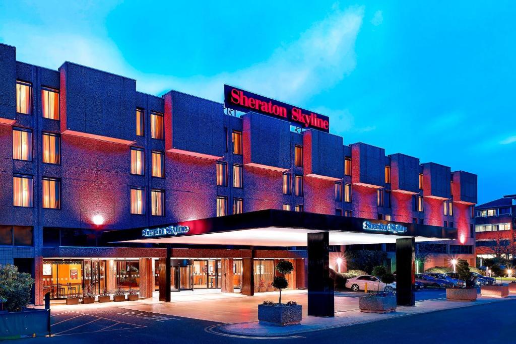 a large building with a sign that reads sheridan hotel at Sheraton Skyline Hotel London Heathrow in Hillingdon