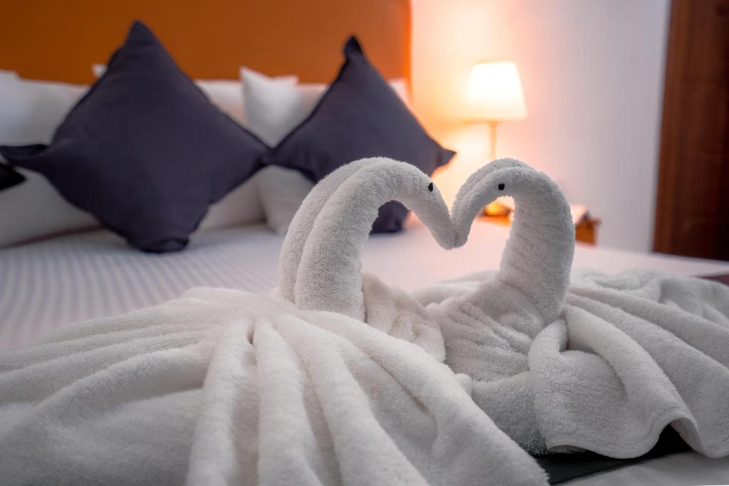Postel nebo postele na pokoji v ubytování العاصمة للشقق الفندقية - Capital Hotel Apartments