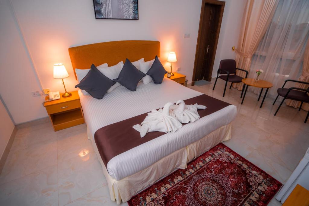Postel nebo postele na pokoji v ubytování العاصمة للشقق الفندقية - Capital Hotel Apartments