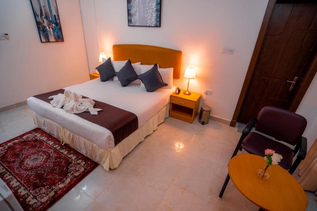 Postel nebo postele na pokoji v ubytování العاصمة للشقق الفندقية - Capital Hotel Apartments