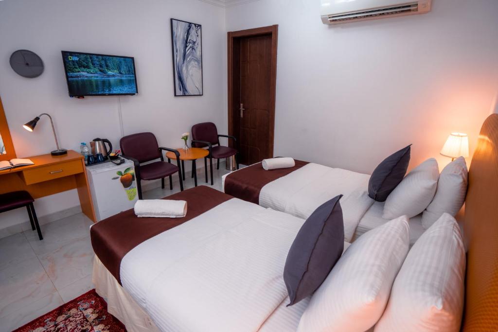 TV a/nebo společenská místnost v ubytování العاصمة للشقق الفندقية - Capital Hotel Apartments