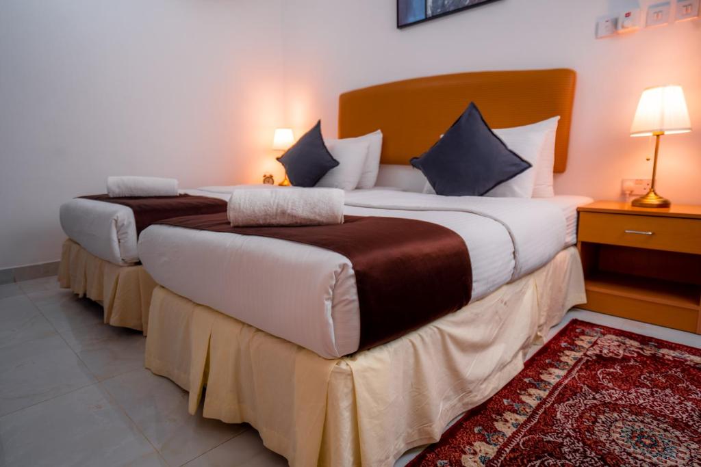 Postel nebo postele na pokoji v ubytování العاصمة للشقق الفندقية - Capital Hotel Apartments