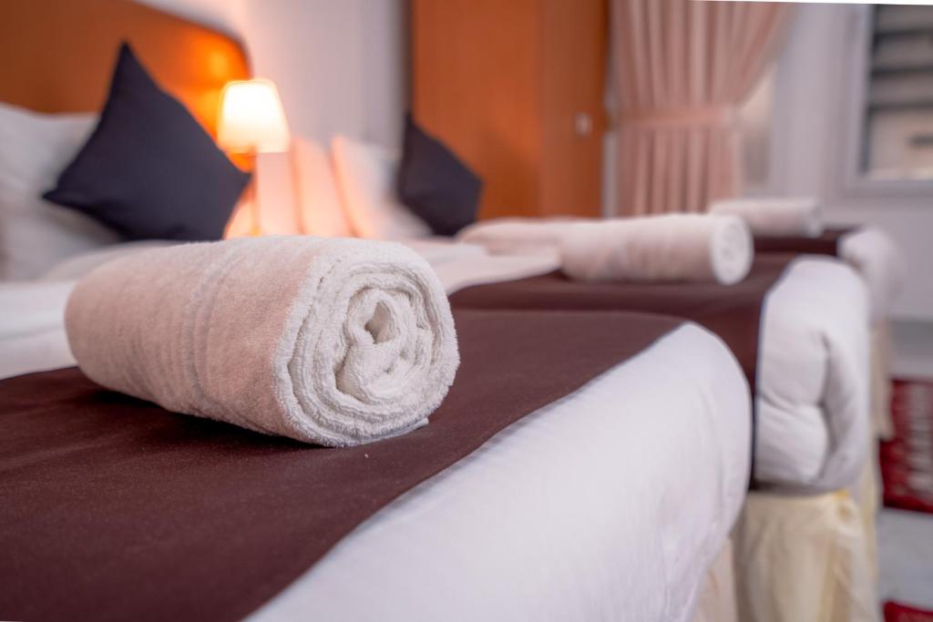 Postel nebo postele na pokoji v ubytování العاصمة للشقق الفندقية - Capital Hotel Apartments