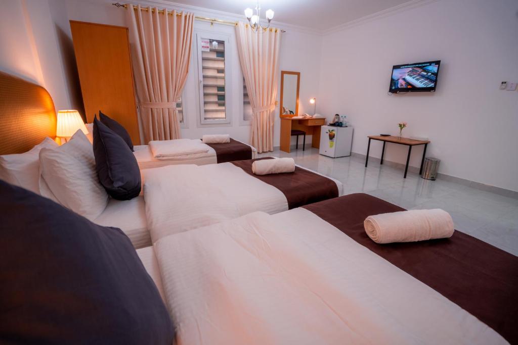 Postel nebo postele na pokoji v ubytování العاصمة للشقق الفندقية - Capital Hotel Apartments