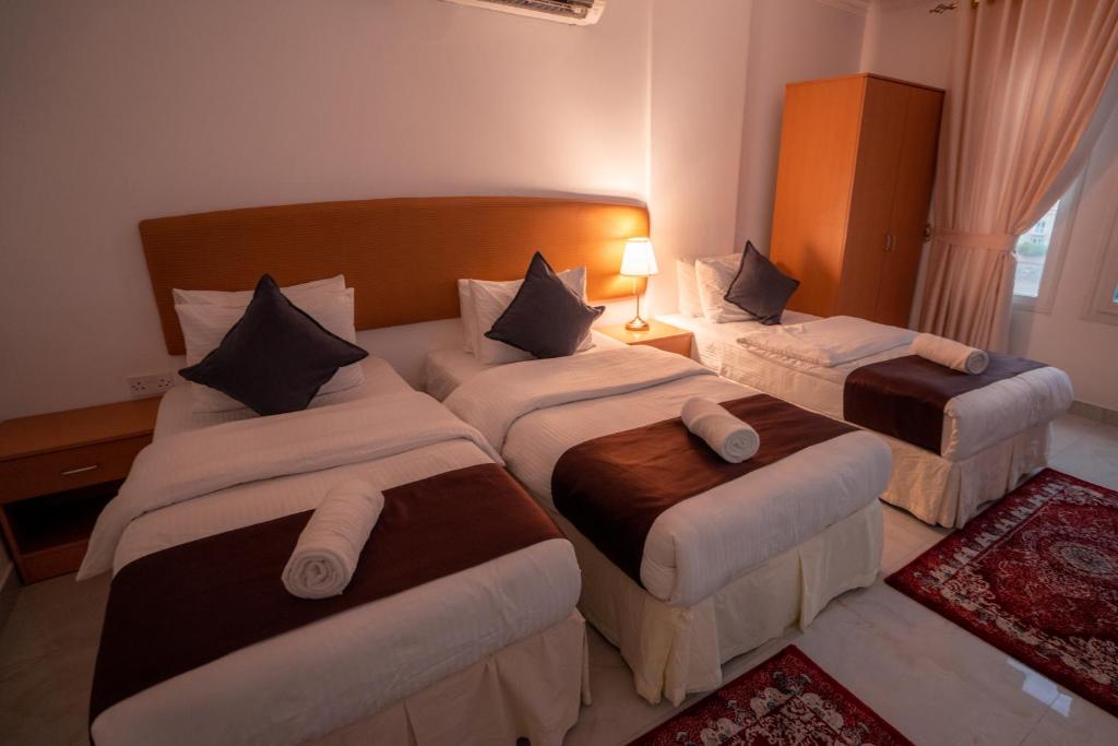 Postel nebo postele na pokoji v ubytování العاصمة للشقق الفندقية - Capital Hotel Apartments