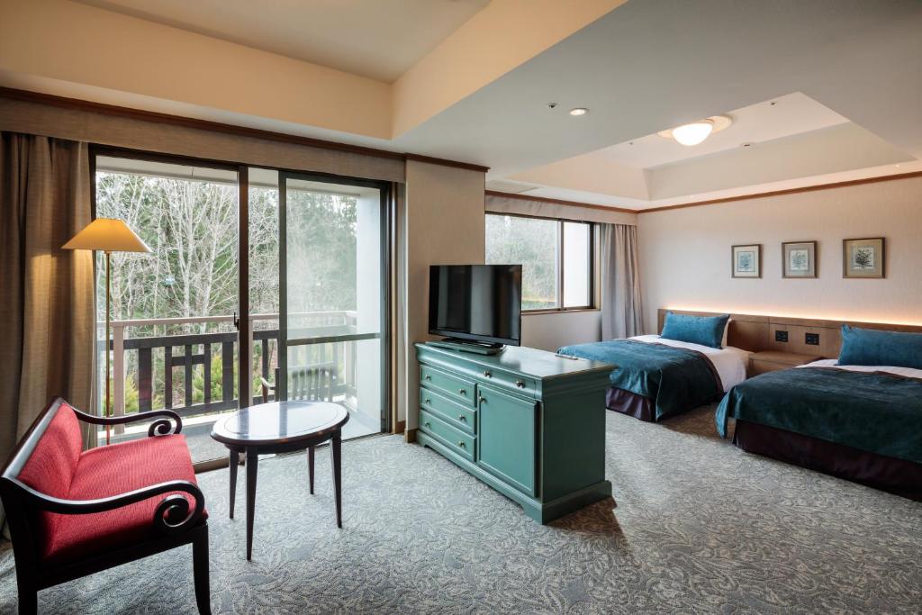 Postel nebo postele na pokoji v ubytování Hakuba Tokyu Hotel