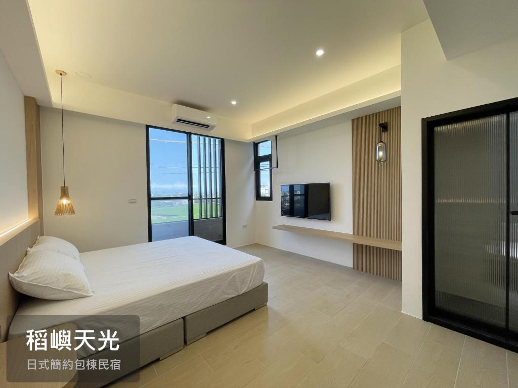 TV o dispositivi per l'intrattenimento presso 稻嶼天光包棟民宿