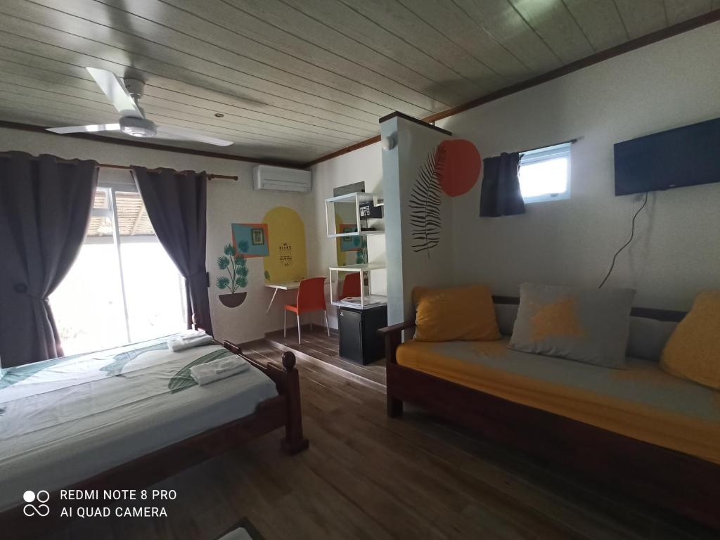 Postel nebo postele na pokoji v ubytování La Maison Du Voyage