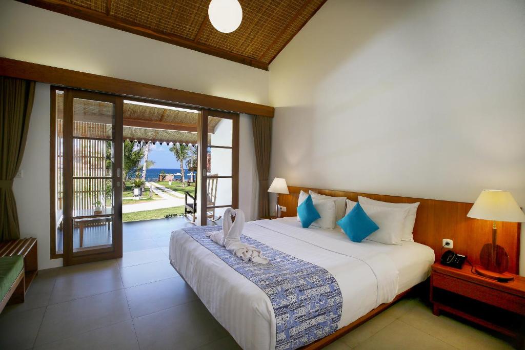 Postel nebo postele na pokoji v ubytování Villa So Long Banyuwangi - Ijen